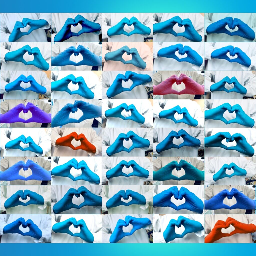 multiple hands with blue, red and violet gloves of laboratory people wearing a white lab coat forming a heart.