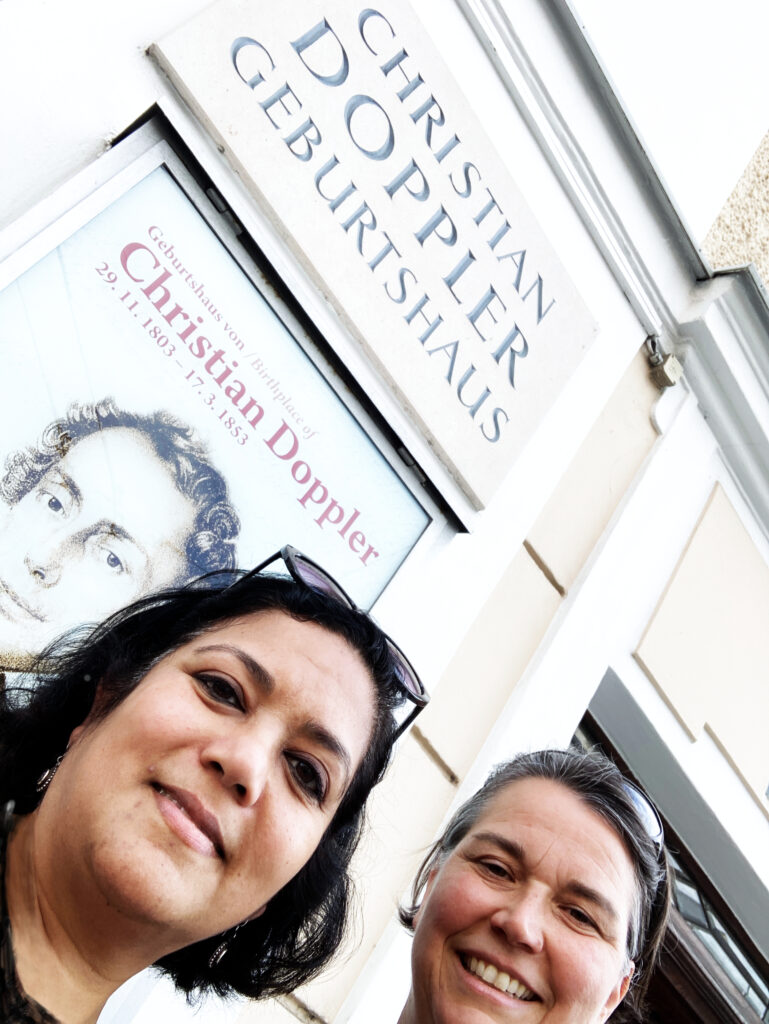 Adelheid Weidinger and Asmita Banerjee from lablife in front of Christian Doppler’s birthplace in Salzburg, Austria.